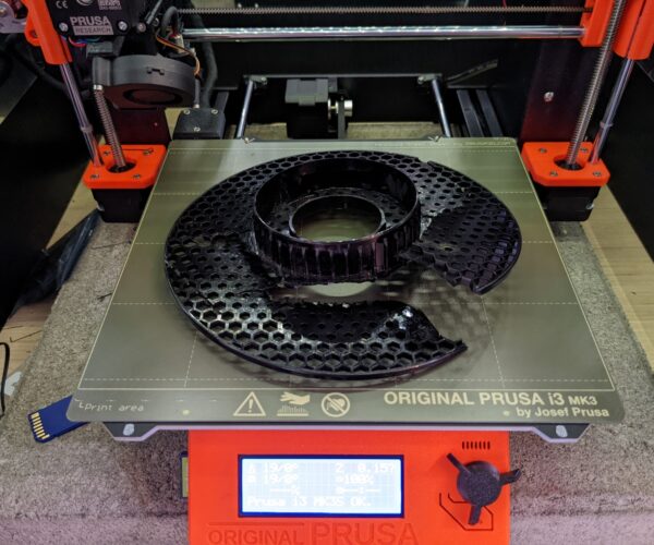 Torn Prusament spool displaed on printer bed