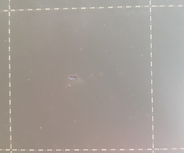 Coating came off the sheet. Leaving what looks like a hole. Second top view.